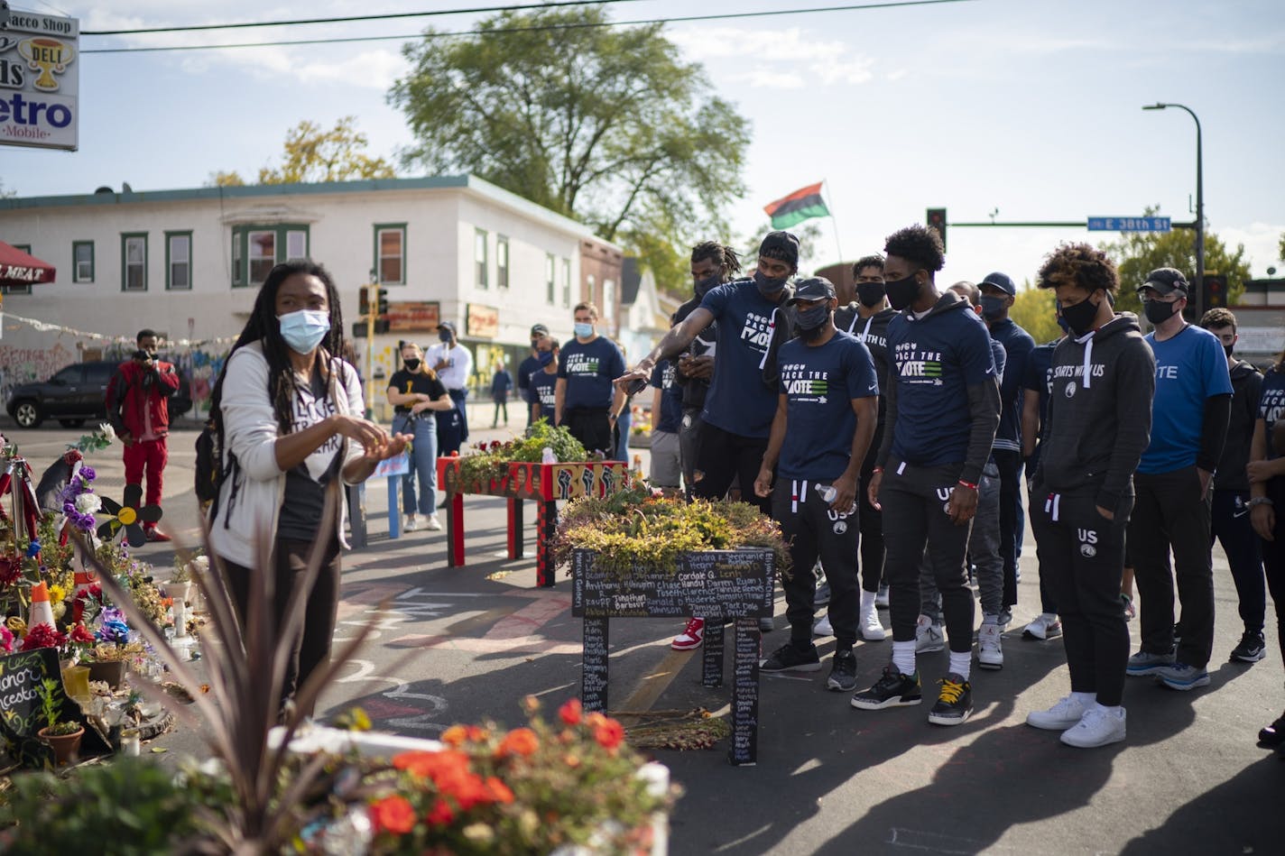 Timberwolves players, coaches, and staffers listened to Jeanelle Austin, left, as she explained and interpreted the memorial site for the group. The four players in the foreground are, from left, the Timberwolves' Jarred Vanderbilt, Jordan McLaughlin, and Jaylen Nowell, and at right is Lindell Wigginton, a former Iowa State player who now plays in the Israeli Premier League.