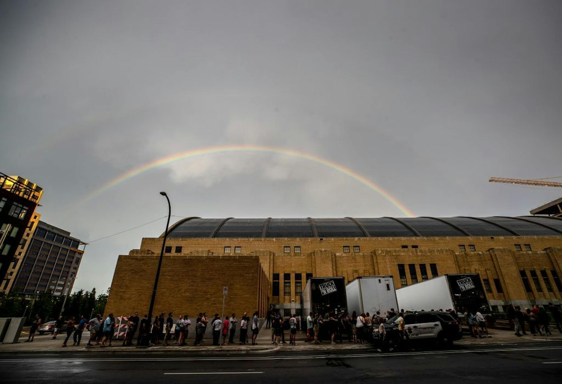 A rainbow appeared over the Minneapolis Armory as fans waited for a Raconteurs concert. The region saw severe weather, including tornado warnings on Monday.
