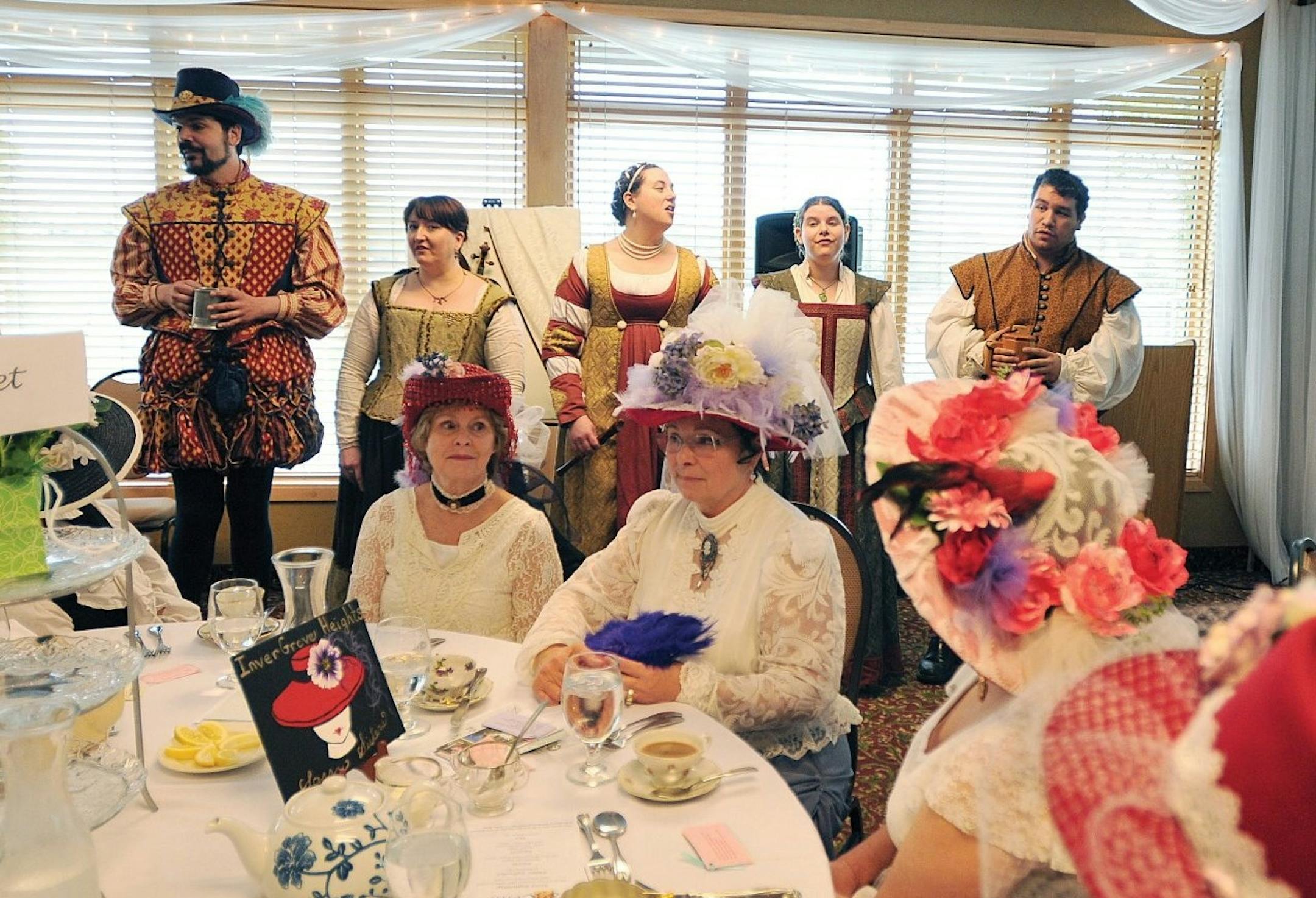 Courtesy of Dakota City DeCantus a cappella ensemble--(left to right) Christopher Sibilia. Laural Hove-Tausend, Kadee Crottier, Shana Marchand, and Dan Skaarup performed at last yearís Lady Jane Victorian Tea, while members of an Inver Grove Heights red hatters group listened.