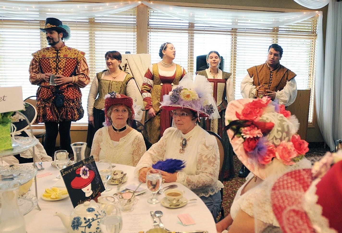 Courtesy of Dakota City DeCantus a cappella ensemble--(left to right) Christopher Sibilia. Laural Hove-Tausend, Kadee Crottier, Shana Marchand, and Dan Skaarup performed at last year&#xed;s Lady Jane Victorian Tea, while members of an Inver Grove Heights red hatters group listened.