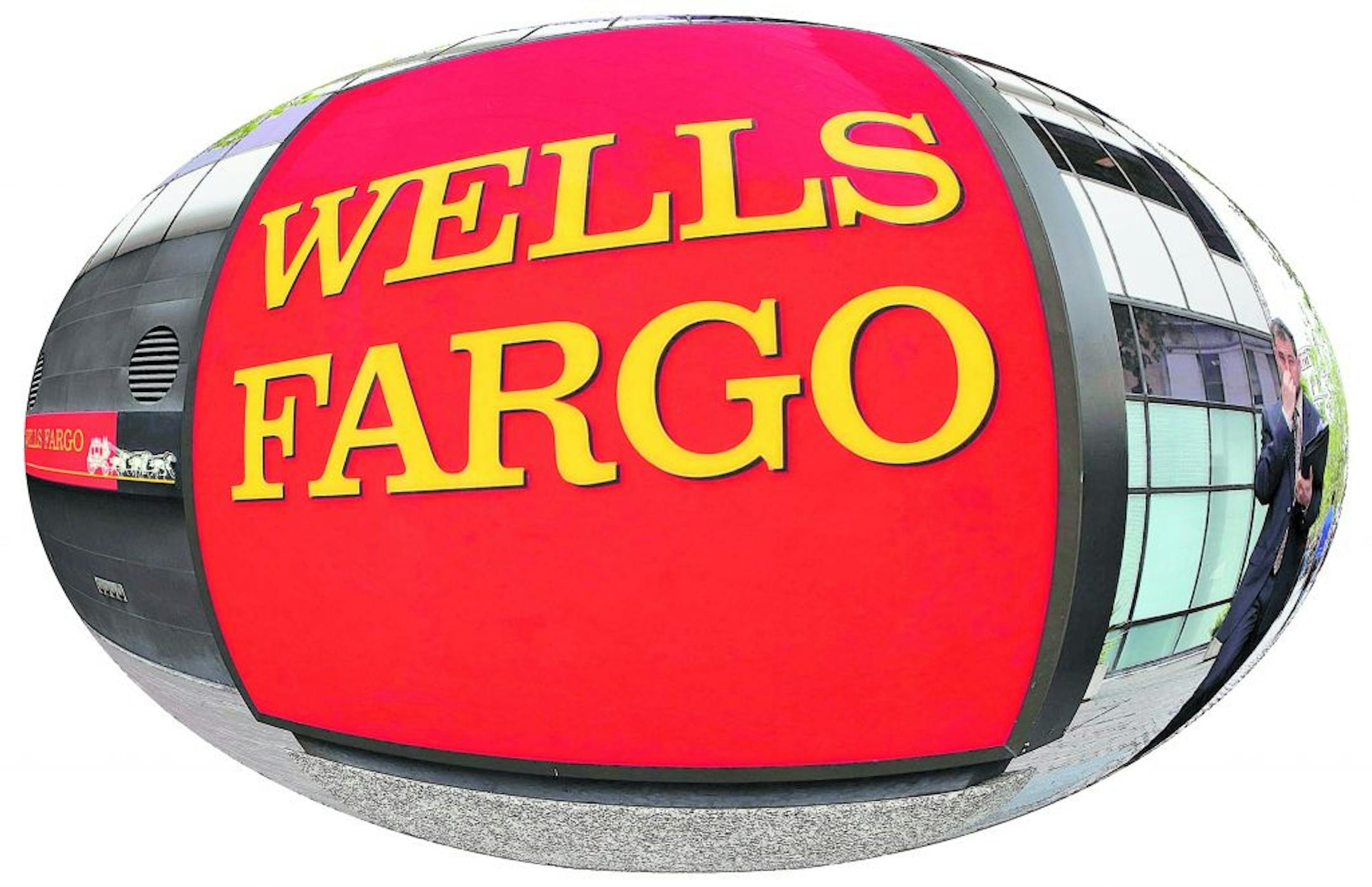 OAKLAND, CA - JULY 22: A pedestrian walks by a Wells Fargo Bank office July 22, 2009 in Oakland, California. Wells Fargo reported an 81 percent increase in second quarter profits with earnings of $2.58 billion, or 57 cents per share compared to $1.75 billion, or 53 cents per share one year ago.