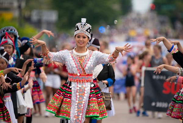 Thousands of Minnesotans lined a parade route in St. Paul on Aug. 8, 2021, to celebrate the Olympic triumph of Hmong American gymnast Suni Lee.