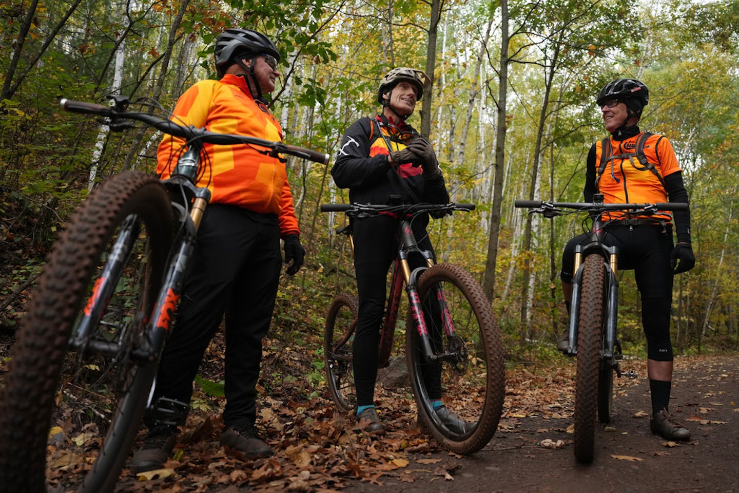 A group of trail regulars who helped make the Cuyuna Country State Recreation Area a mountain biking destination, from left, John Schaubach, Dan Cruser, and Jim McCarvill discuss their efforts during a morning ride Thursday, Oct. 5, 2023 in Ironton, Minn. ] ANTHONY SOUFFLE • anthony.souffle@startribune.com