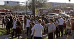 Students are released from a lockdown following a shooting at Marjory Stoneman Douglas High School in Parkland, Fla., on Wednesday, Feb. 14, 2018. (Jo