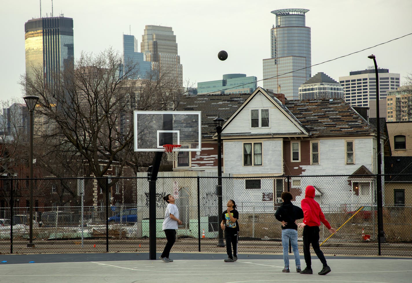 A pickup basketball game at Peavey Field Park in Minneapolis on March 26. Officials were concerned about people not practicing social distancing.