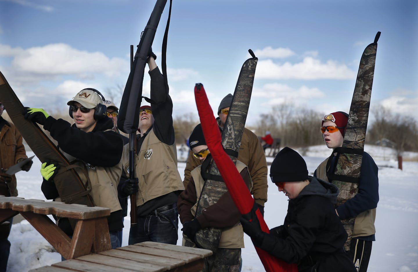 At Minneapolis Gun Club in Prior Lake, Apple Valley trap shooting club members put away their guns after shooting their quota.]rtsong-taatarii@startribune.com