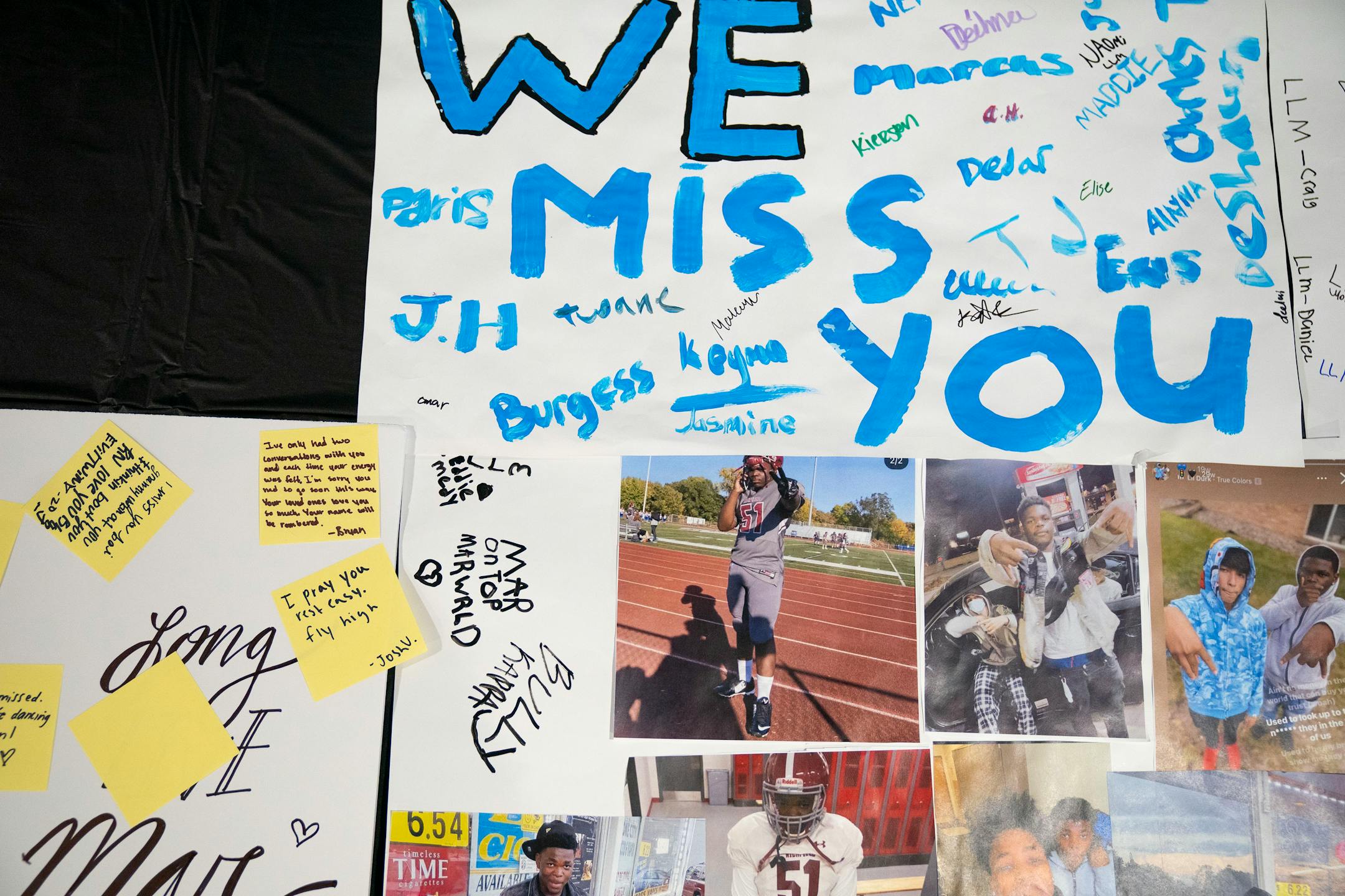 Posters signed by Jahmari Rice's friends and family were on display outside before his funeral Wednesday.
