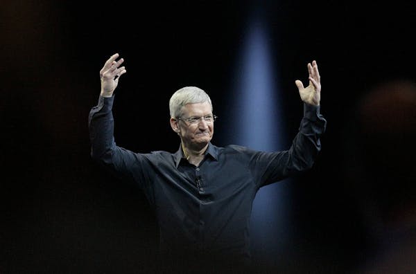 FILE - In this June 2, 2014 file photo, Apple CEO Tim Cook gestures during the Apple Worldwide Developers Conference in San Francisco. Apple's stock t