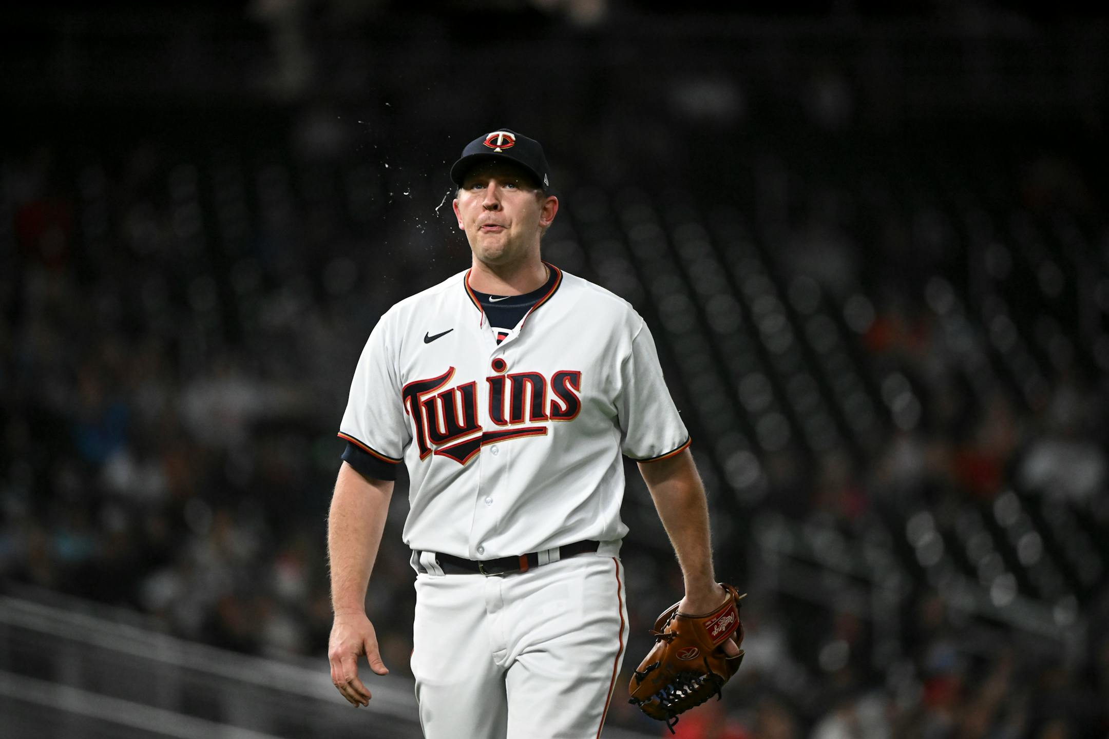 Minnesota Twins relief pitcher Tyler Duffey (21) spits as he reacts after striking out swinging Oakland Athletics center fielder Cristian Pache (20) to end the top of the 8th inning.