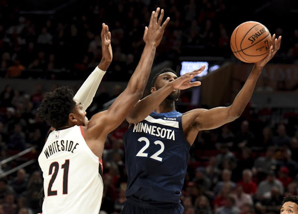 Andrew Wiggins, right, drove to the basket against Portland on Saturday.