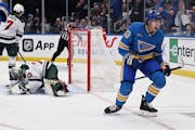 The Blues' Jake Neighbours (63) celebrates scoring a goal against the Wild during second period Saturday in St. Louis.