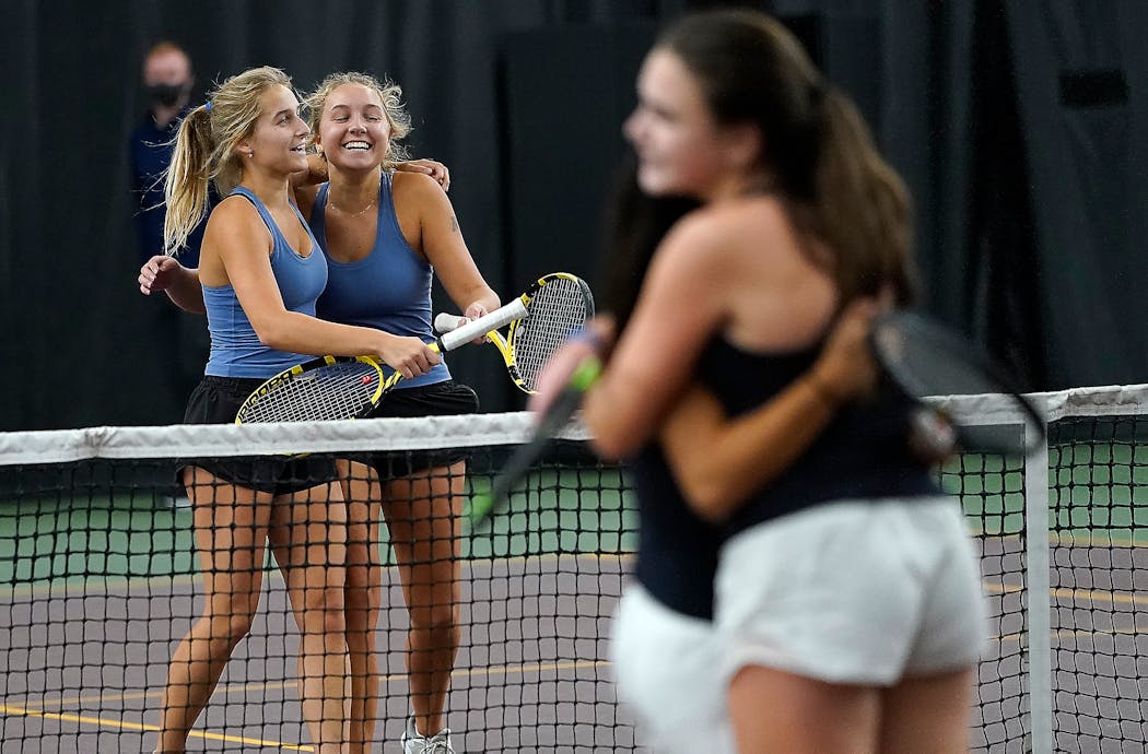 Annika Elvestrom (left) and sister Karina of Minnetonka celebrated their 2022 doubles state title after their finals victory over a Blake duo. Annika has graduated; Karina returns for her senior season and is a team captain.
