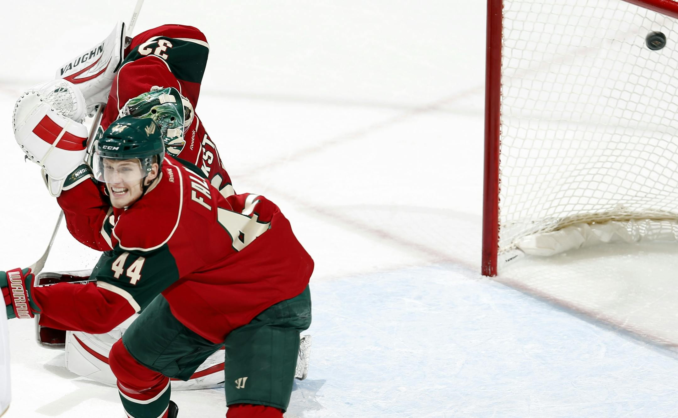 With Justin Falk (44) helping defend the goal, Luca Sbisa (5) of Anaheim (not pictured) shot the puck past Wild goalie Niklas Backstrom (32) for the go-ahead goal in the third period. Anaheim beat Minnesota by a final score of 2-1.