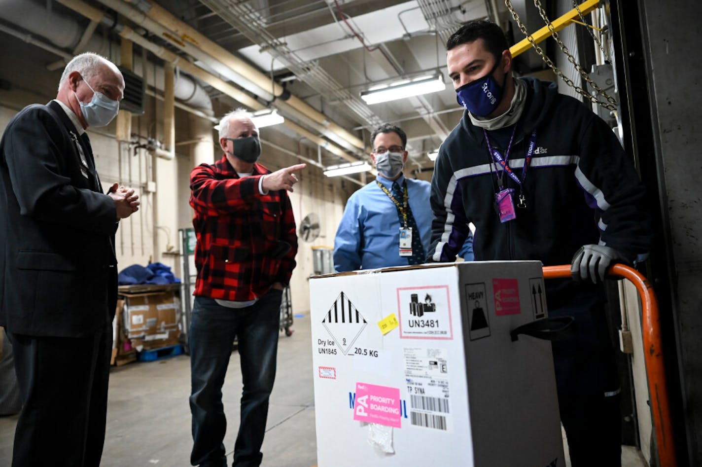 FedEx driver Seth Warnecke delivered a box containing doses of the Pfizer-BioNTech&nbsp;COVID-19 vaccine to the Minneapolis VA Hospital on Monday as VA director Patrick Kelly and&nbsp;Gov.&nbsp;Tim&nbsp;Walz observed.