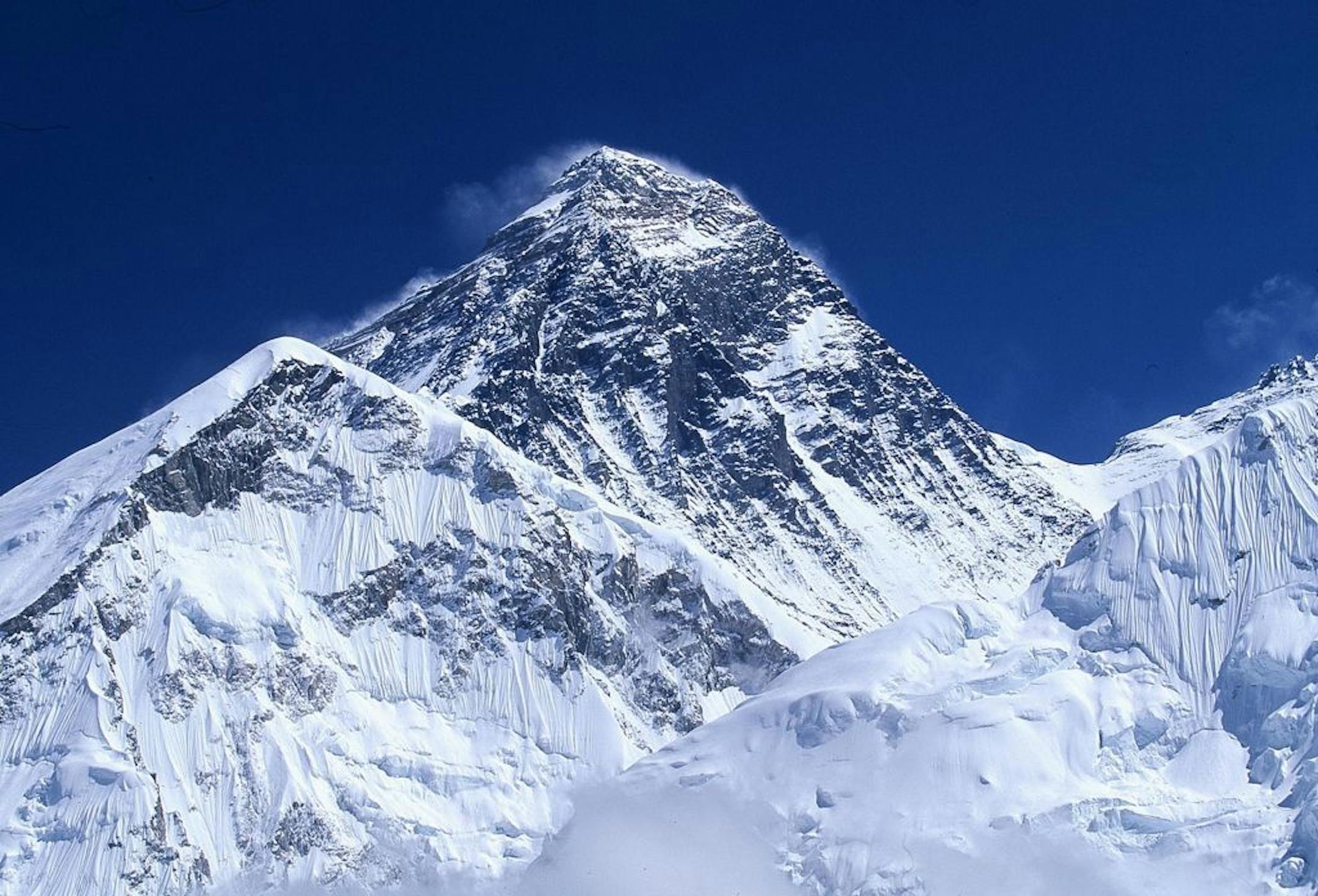 Mt. Everest, the highest mountain on earth, as seen on Dec. 1, 2004. Though scaling Everest has become a lucrative adventure sport, Sherpas, many of whom use their ethnic group as a last name, say they are not getting their fair share of it. Since commercial expeditions began in the early 1990s, wealthy clients have lined up to pay up to $65,000 to companies that organize expeditions.