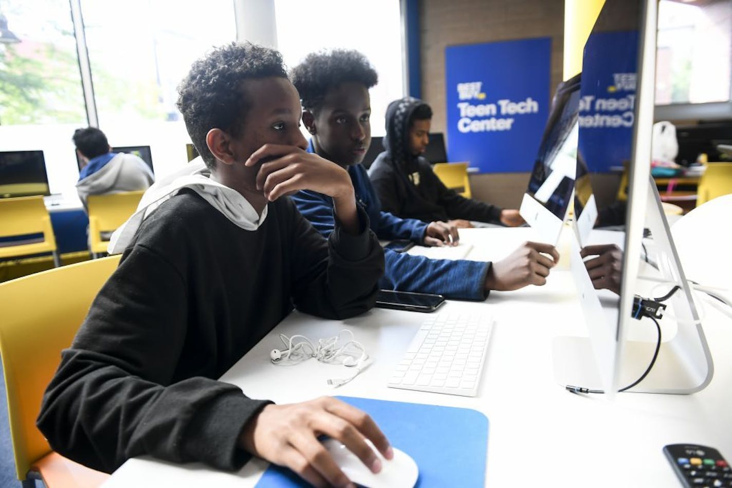 From left, Hanad Mohamud, 15, Mohamed Ali, 15, and Najeeb Jama, 16, worked on various graphic design projects Thursday at Best Buy's Teen Tech Center in Minneapolis.