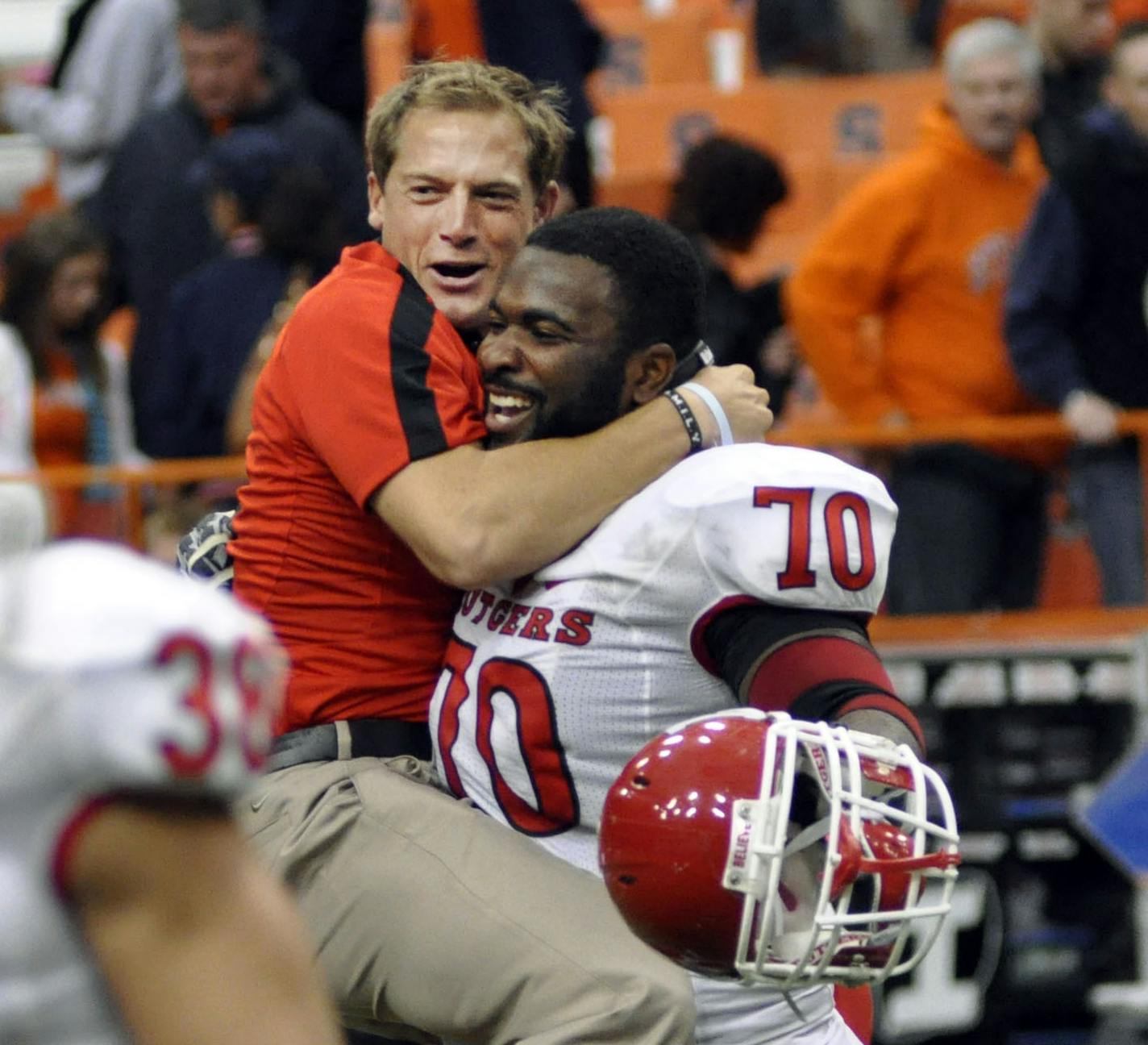 P.J. Fleck, then a wide receivers coach at Rutgers, and Desmond Wynn celebrate their 19-16 double overtime win over Syracuse on Oct. 1, 2011 at the Carrier Dome.