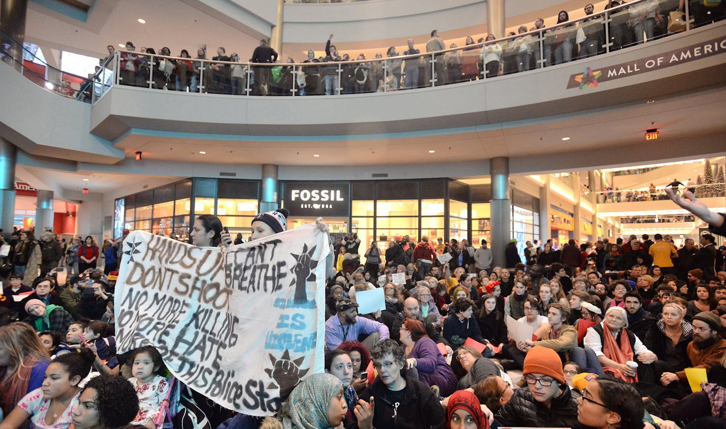 Protestors at the Mall of America in Bloomington, Minn., on Saturday, Dec. 20, 2014, during a demonstration to focus attention on perceived nationwide race-based police misconduct. (Aaron Lavinsky/Minneapolis Star Tribune/TNS) ORG XMIT: MIN1412201808380099 ORG XMIT: MIN1412221428400228 ORG XMIT: MIN1501081223350840 ORG XMIT: MIN1501091411501169