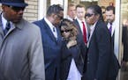 Prince's sister Tyka Nelson, center, leaves the Carver County Justice Center in Chaska with her husband Maurice Philips on Monday, May 2, 2016. With t