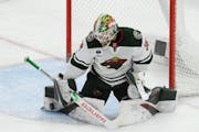 Minnesota Wild goalie Jesper Wallstedt (30) makes a save during the second period of an NHL hockey game against the Chicago Blackhawks Sunday, April 7