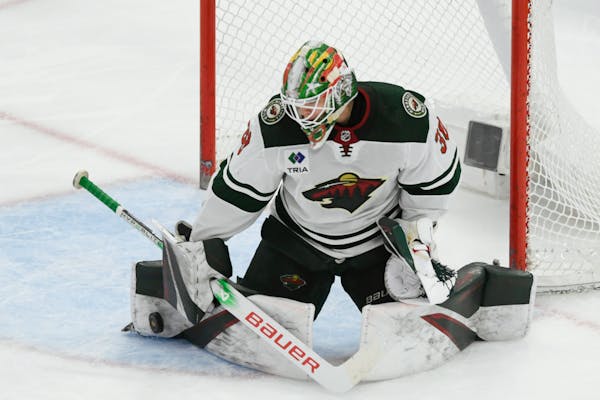 Wild goalie Jesper Wallstedt makes a save against the Blackhawks during the second period Sunday afternoon in Chicago.