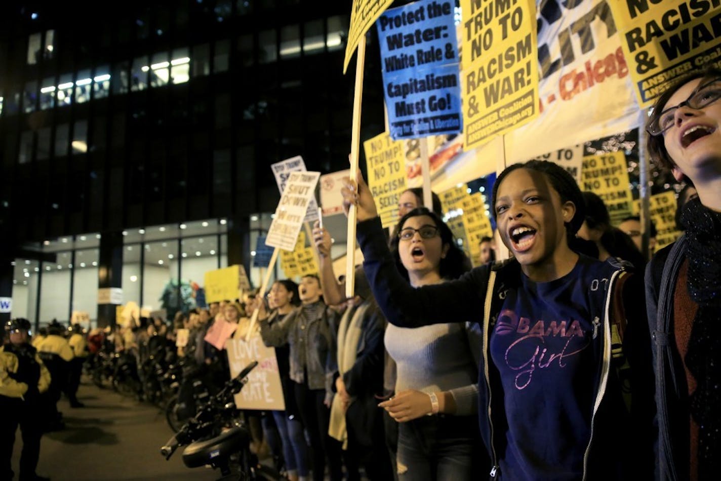 Protesters rally outside the Trump International Hotel and Tower, Wednesday, Nov. 9, 2016 in Chicago, Ill., in opposition of Donald Trump's presidential election victory.