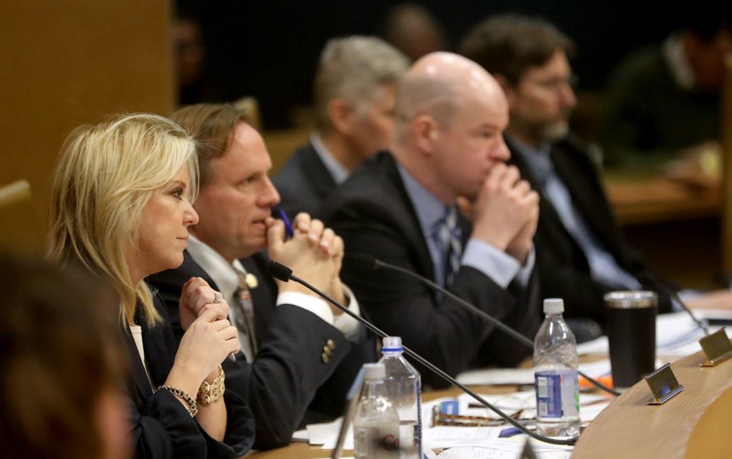 Minnesota State Sen. Karen Housley, Chair of the Senate Aging and Long-Term Care Policy committee, left to right, and fellow Sen. Jim Abeler, both Republicans, listened to Dan Pollock, the state's new acting Department of Health Commissioner and Emily Piper, Commissioner of the Department of Human Services, talk about solutions to elder abuse in Minnesota Wednesday, Jan. 24, 2018, at the Minnesota Senate Building in St. Paul, MN.