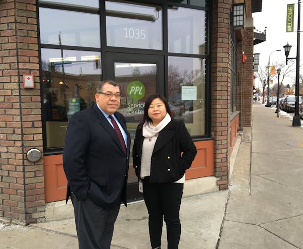 CEO Paul Williams of Project for Pride in Living (PPL) and May Xiong, vice president of employment readiness, outside PPL's headquarters on E. Frankli