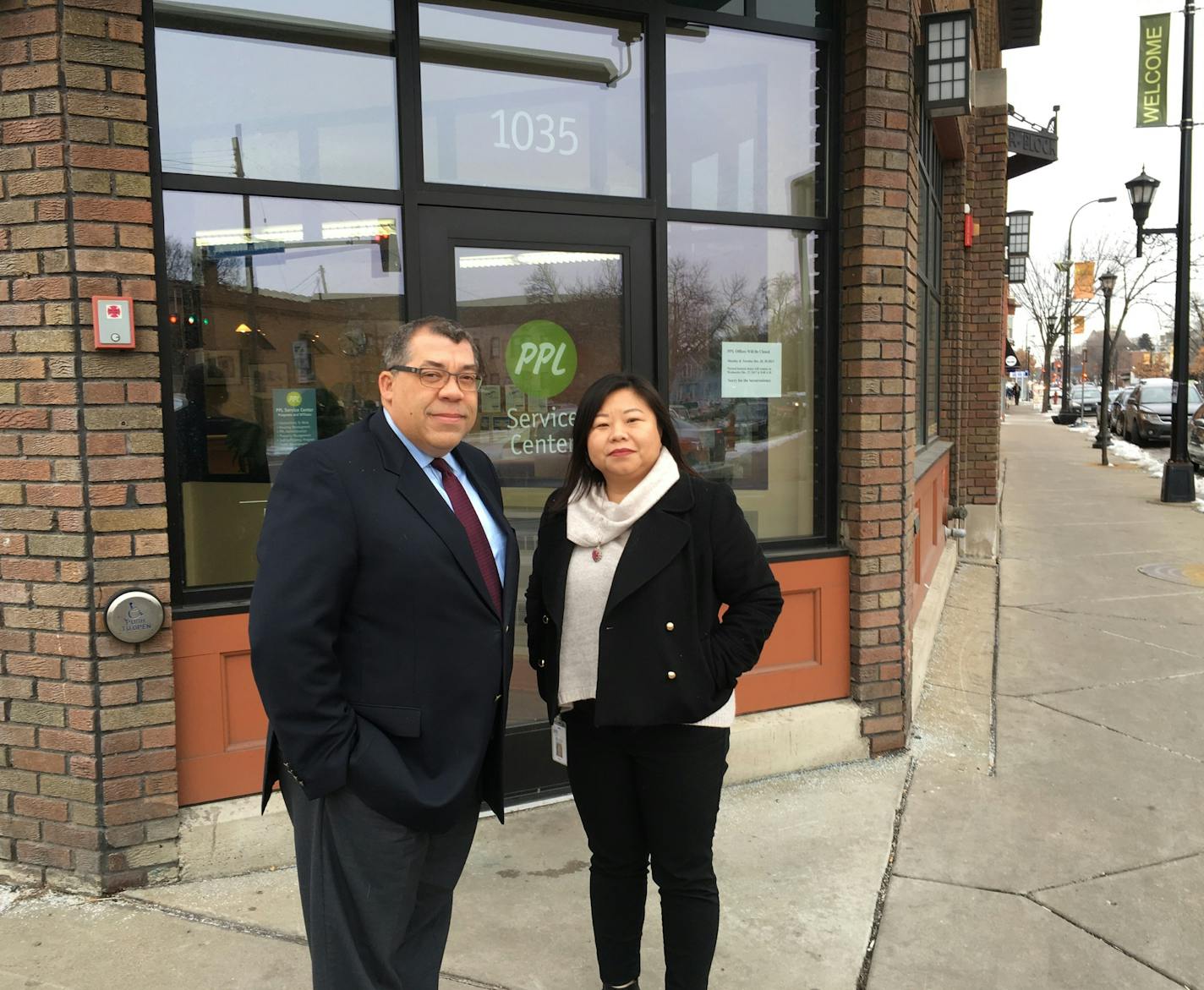 CEO Paul Williams of Project for Pride in Living (PPL) and May Xiong, vice president of employment readiness, outside PPL's headquarters on E. Franklin Avenue. Photo: Neal.St.Anthony@startribune.com