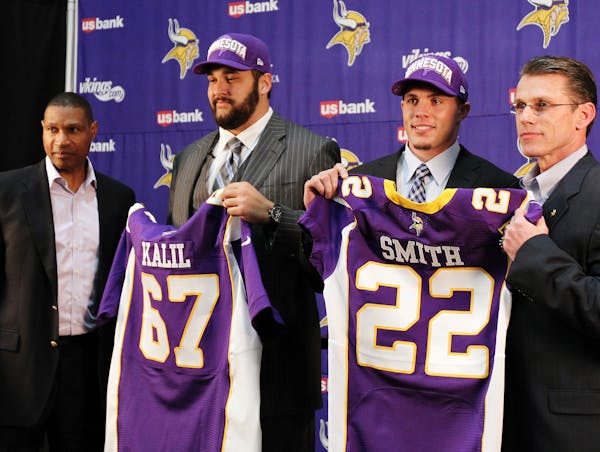 Minnesota Vikings first round draft picks Matt Kalil, second from left, and Harrison Smith are introduced by head coach Leslie Frazier, left, and gene