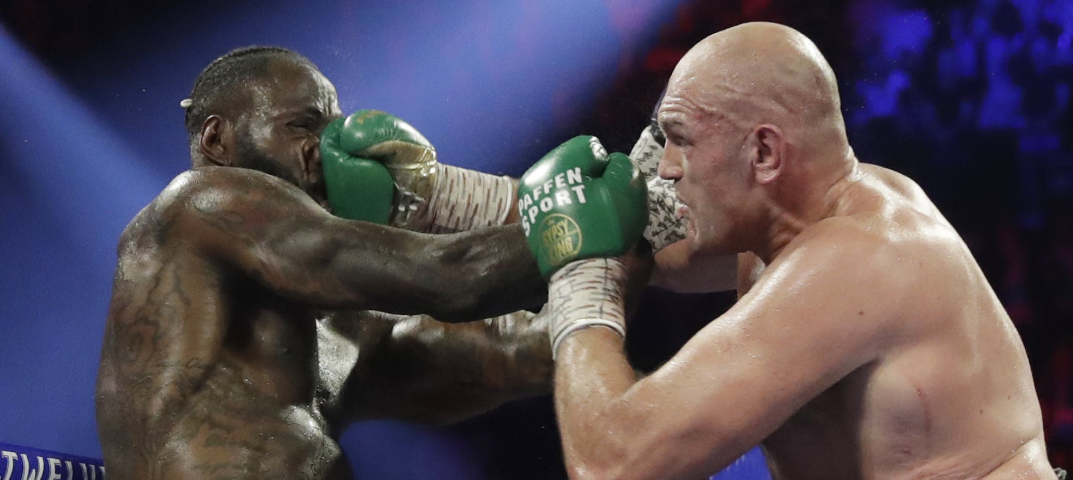 Tyson Fury, of England, lands a right to Deontay Wilder during a WBC heavyweight championship boxing match Saturday, Feb. 22, 2020, in Las Vegas. (AP Photo/Isaac Brekken)