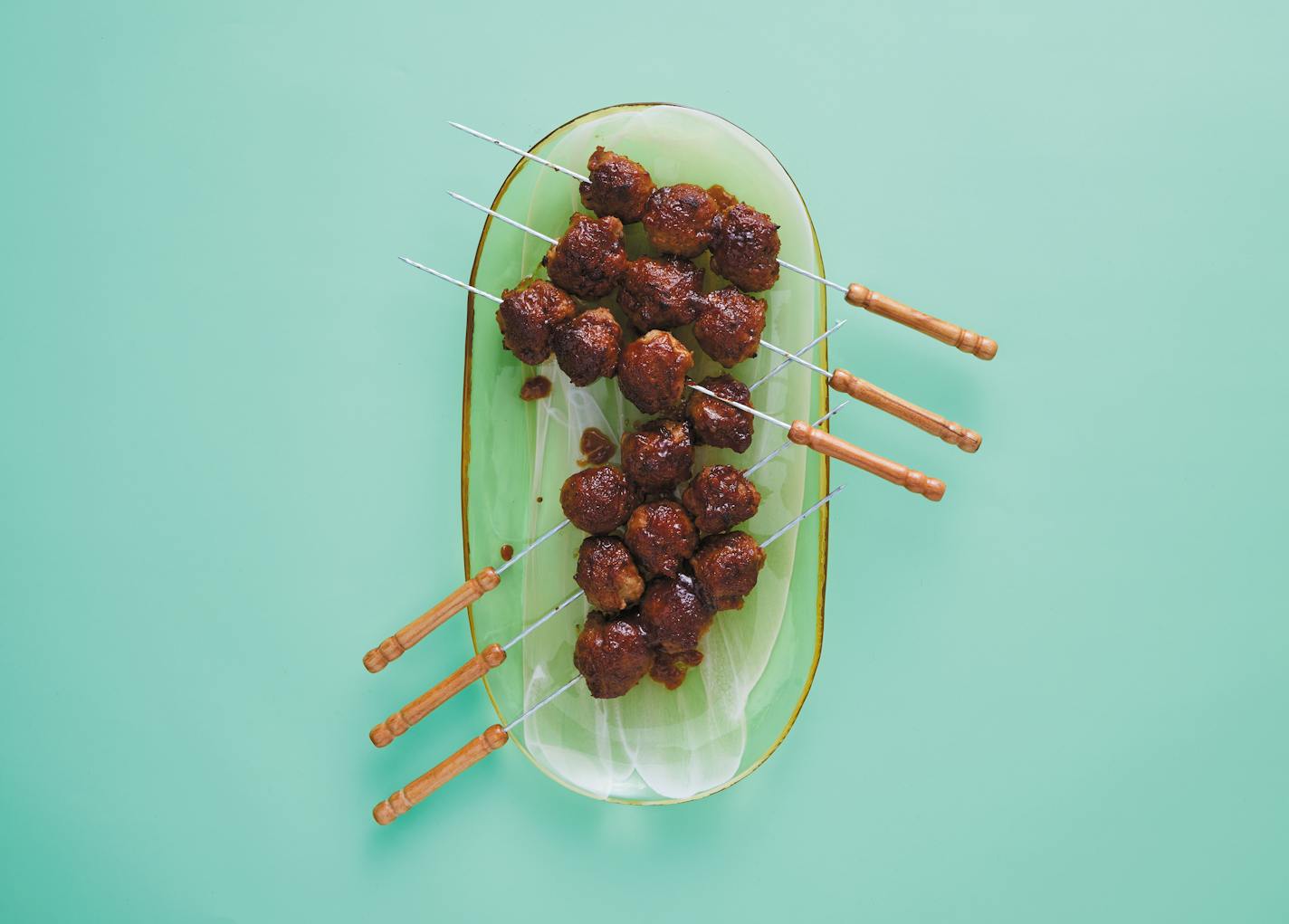 Turkey Tsukune (Meatballs). From "Bar Menu: 100+ Drinking Food Recipes for Cocktail Hours at Home," by André Darlington (Running Press, 2022). Credit: Neal Santos