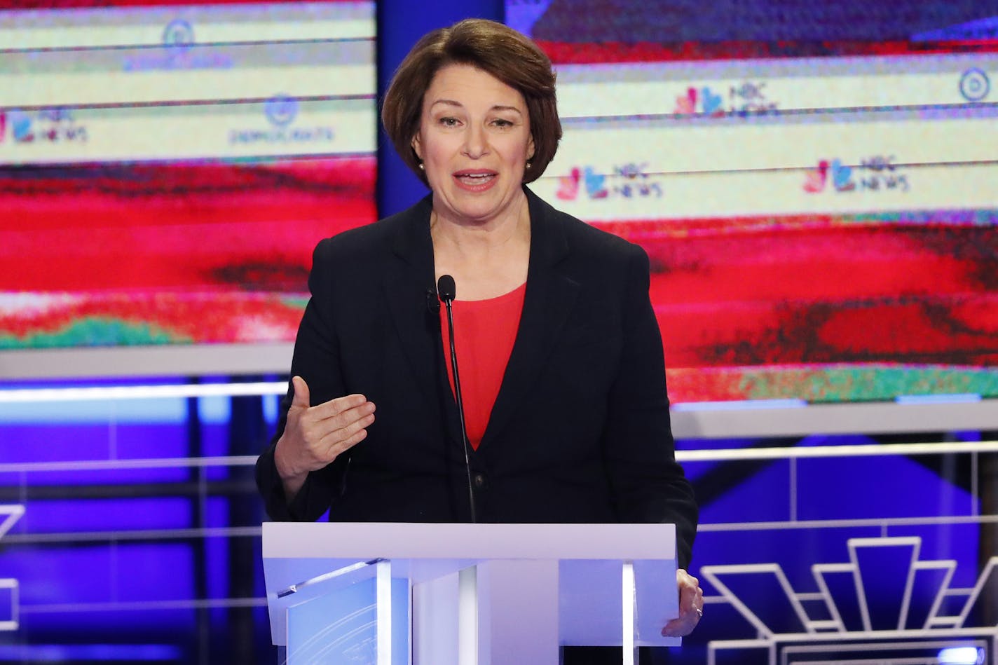 Sen. Amy Klobuchar, D-Minn., gestured during the first Democratic primary debate on June 26. Klobuchar's campaign is working to make sure she reaches the necessary fundraising and polling criteria to make the third debate, in September.