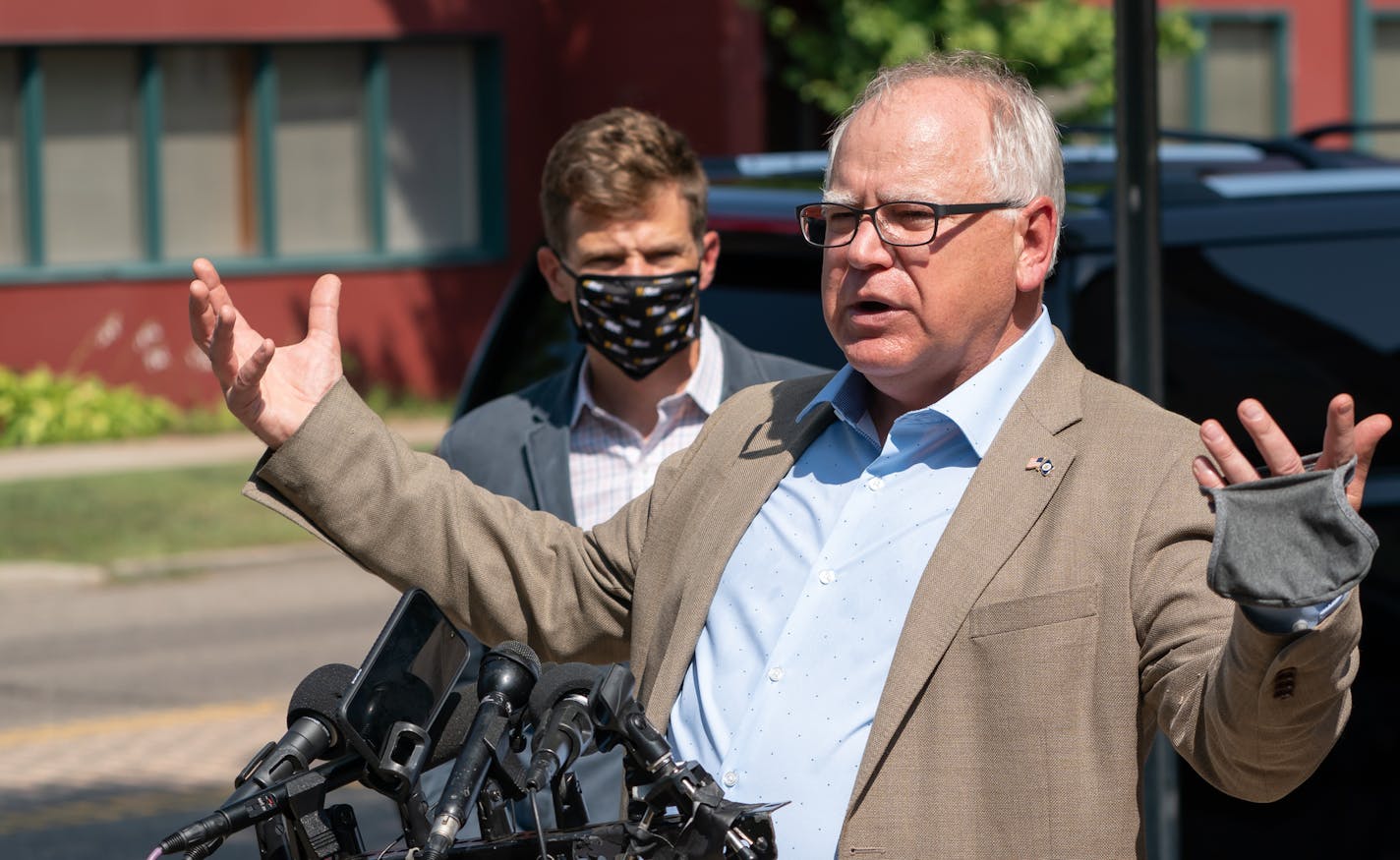 Outside Omari Brow Studio, Governor Tim Walz spoke about Wednesday night's unrest. Behind him is Development Commissioner Steve Grove. ] GLEN STUBBE • glen.stubbe@startribune.com Thursday, August 27, 2020 Governor Tim Walz, Lieutenant Governor Peggy Flanagan, and Development Commissioner Steve Grove visited Golden Thyme Coffee & Cafe and Omari Brow Studio, two businesses that were affected by the COVID-19 pandemic and received financing from the Minnesota Small Business Emergency Loan (SBEL) Pro