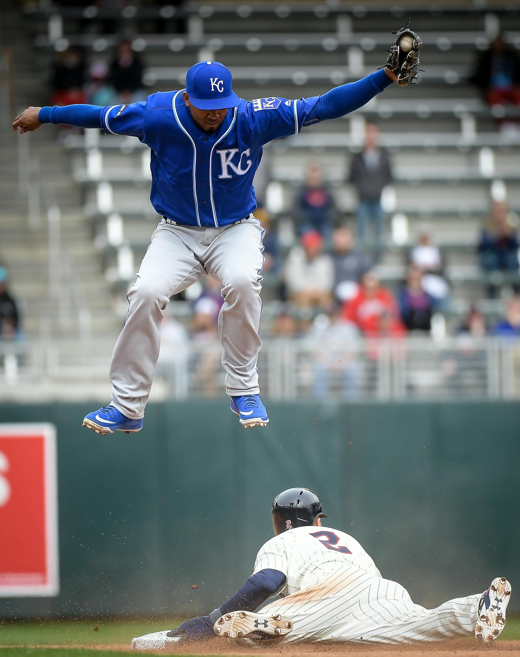 Minnesota Twins second baseman Brian Dozier (2) slid safely to second off a steal as Kansas City Royals shortstop Alcides Escobar (2) was unable to pull the ball in time for the tag. ] AARON LAVINSKY ï aaron.lavinsky@startribune.com The Minnesota Twins played the Kansas City Royals on Wednesday, April 5, 2017 at Target Field in Minneapolis, Minn.