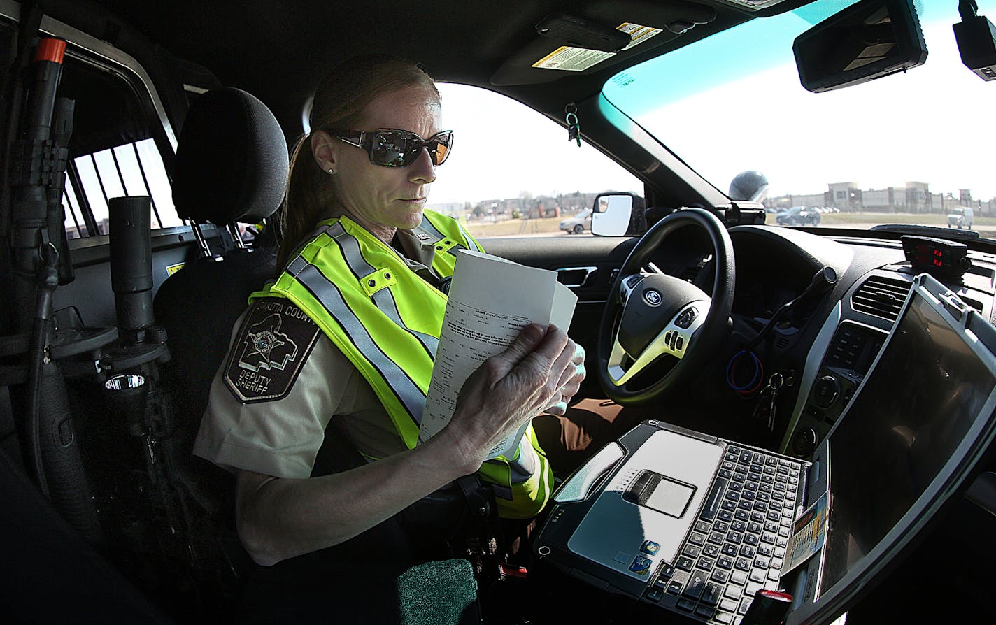 Dakota County Deputy Jennifer Lenarz issued a ticket to a driver who had been texting while behind the wheel of a motor vehicle.] JIM GEHRZ &#xef; james.gehrz@startribune.com / Rosemount, MN / April 13, 2016 /1:00 PM &#xf1; BACKGROUND INFORMATION: The Dakota County Sheriff's Office is pulling out all the stops to nab distracted drivers. Deputies are using GoPro cameras to catch drivers who are texting behind the wheel, then armed with evidence pulling them over and writing them tickets.