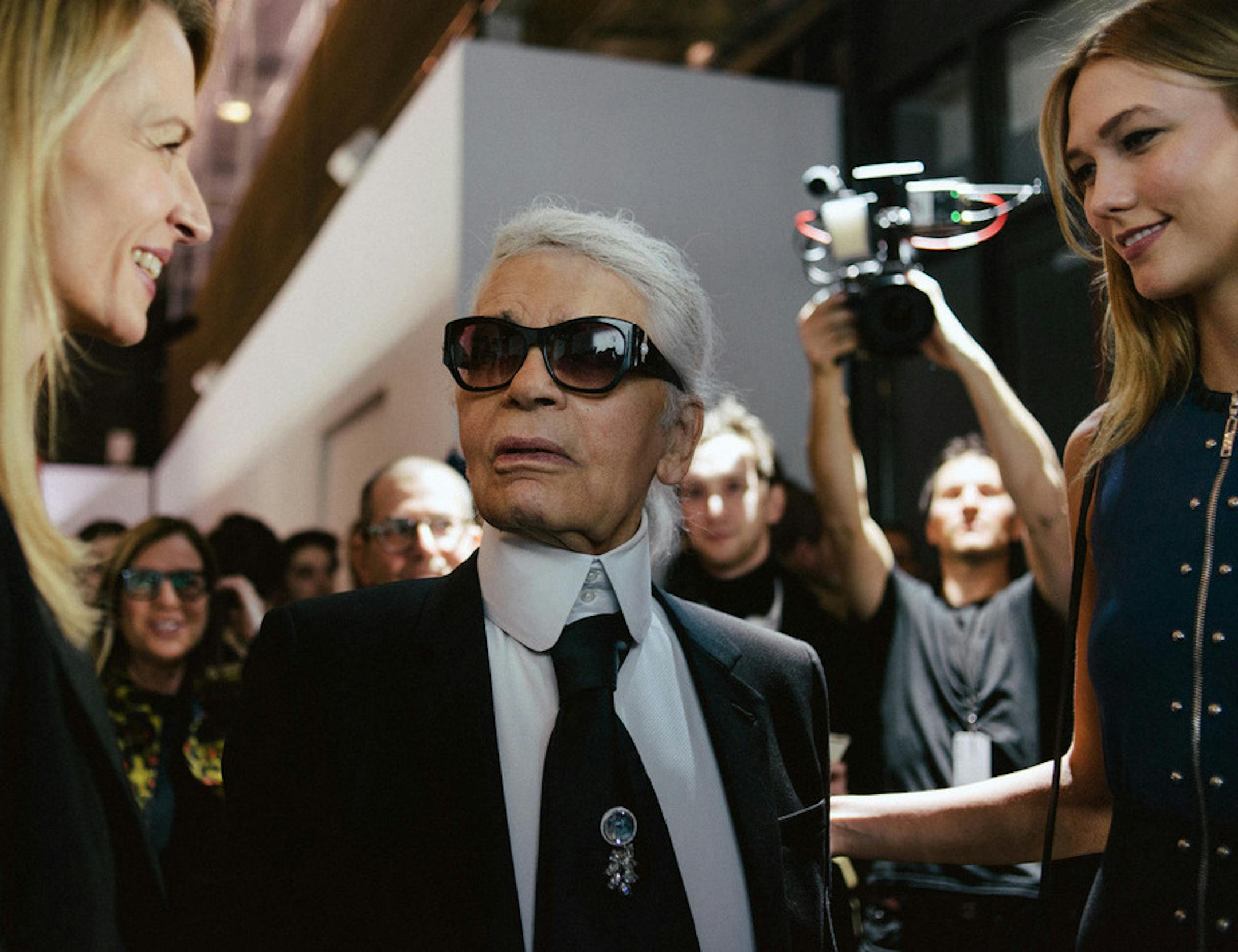 FILE -- Karl Lagerfeld speaks with Louis Vuitton Executive Vice President Delphine Arnault, left, and the model Karlie Kloss at a cocktail reception in Paris on March 2, 2016. Lagerfeld, the most prolific designer of the 20th and 21st centuries and a man whose career formed the prototype of the modern luxury fashion industry, died on Feb. 19, 2019, in Paris. He was 85. (Dmitry Kostyukov/The New York Times)