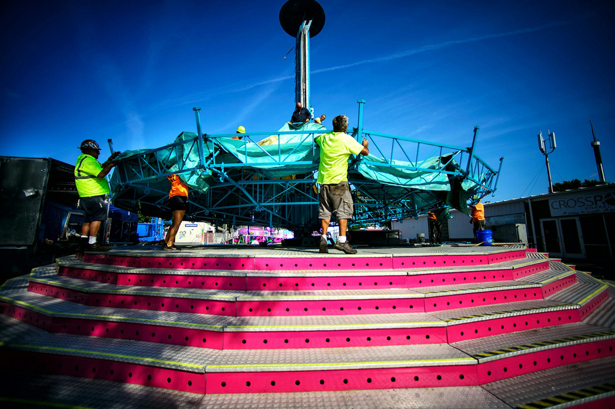 A crew from Myers Entertainment set up the Wave Swinger ride at the Fair. The opening of the 2014 Minnesota State Fair is less than a week away and the place is hopping. ] Thursday, August 14, 2014. GLEN STUBBE * gstubbe@startribune.com
