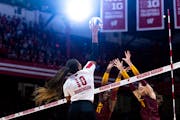 Wisconsin Devyn Robinson (10) spikes the ball in the first set against Minnesota during an NCAA college volleyball match in Madison, Wis., Sunday, Oct