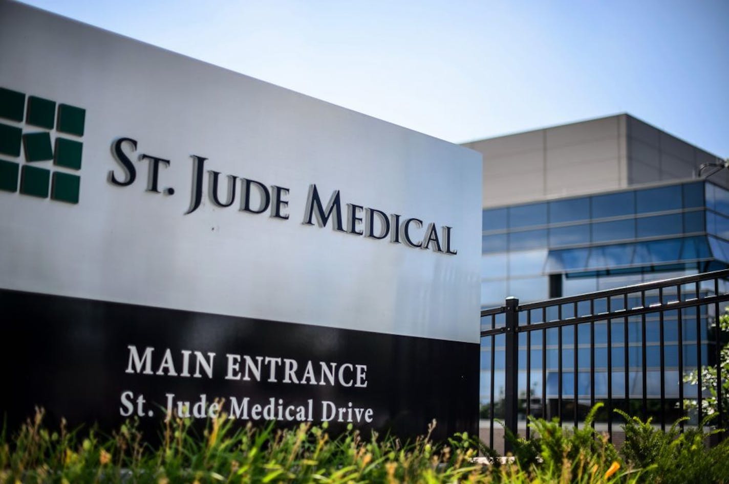 This Wednesday, July 22, 2015, photo shows St. Jude Medical corporate headquarters, in Little Canada, Minn., just north of St. Paul. Abbott Laboratories will spend $19.3 billion to buy St. Jude Medical Inc. in a cash-stock deal that aims to strengthen the medical device maker's stake in cardiovascular care, the companies announced Thursday, April 28, 2016. The combined company will offer devices in nearly every area of cardiovascular care, competing directly with industry leaders Medtronic Inc.