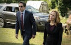 This photo provided by FOX shows, David Duchovny, left, as Fox Mulder and Gillian Anderson as Dana Scully in the "Founder's Mutation" season premiere,