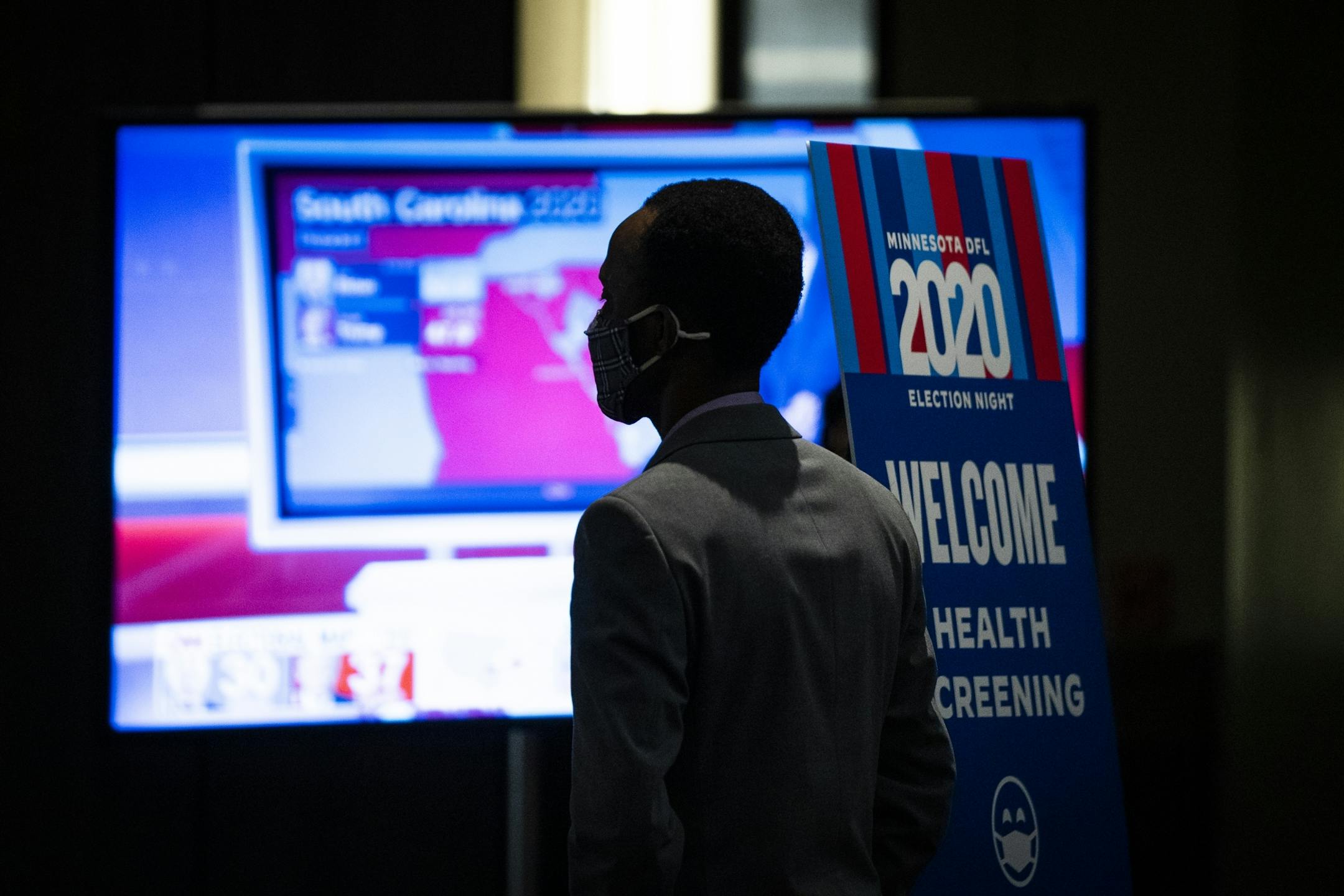 DFL staffer Ian Oundo watched the election returns on CNN during the DFL Election Night Watch Party.
