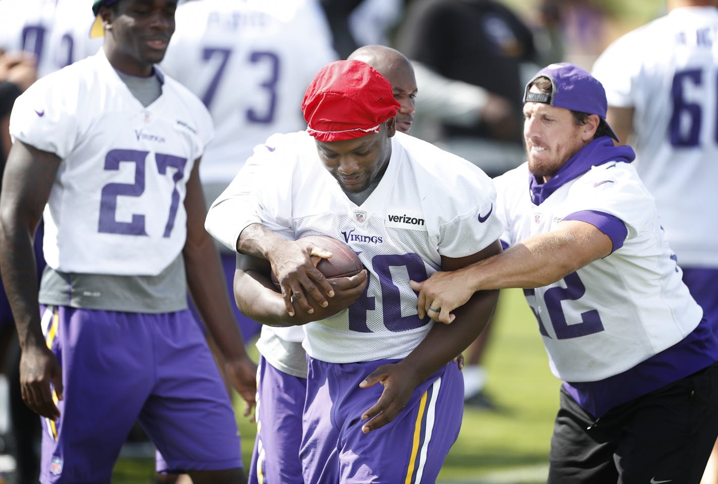 Chad Greenway tried to knock the all away from Kentrell Brothers during practice Thursday August 4, 2016 in Mankato, MN.