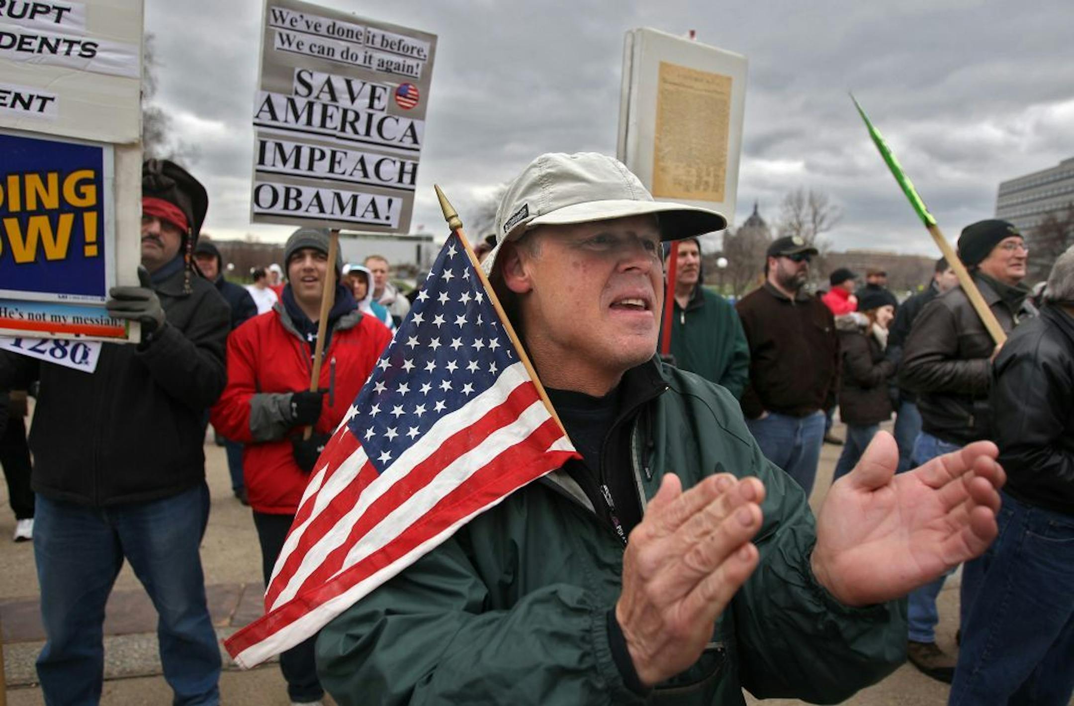 Rick Tracy, Minneapolis, applauded as he listened to one of the speakers at the rally. Tracy said that he supports smaller government, less spending and more freedom.