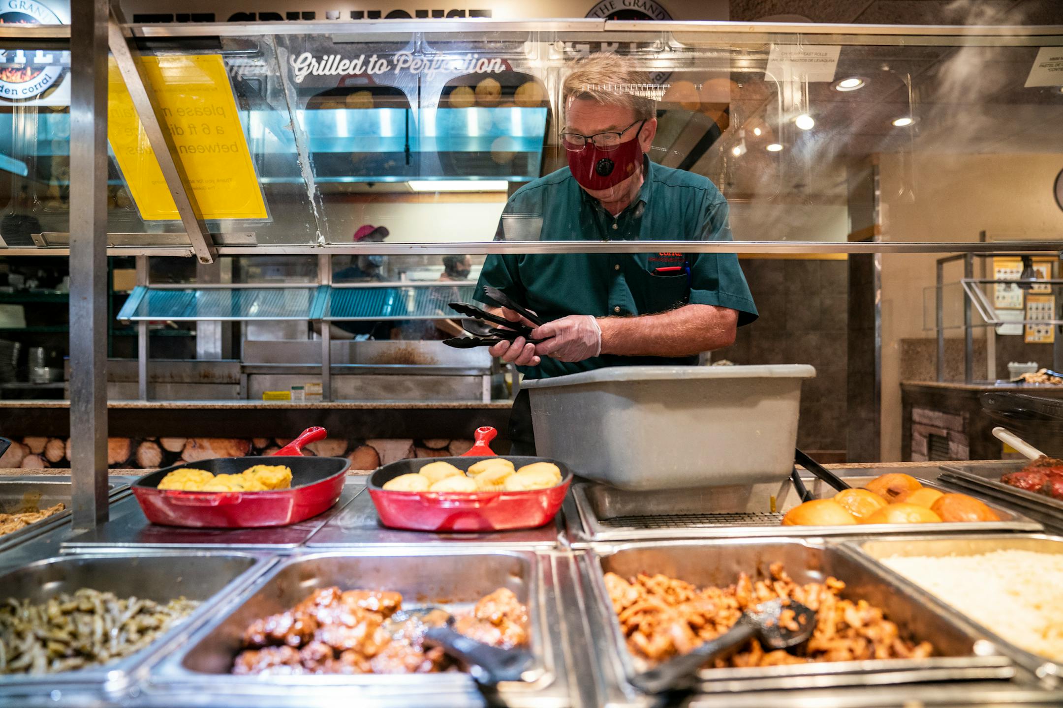 Manager Marco Hanson changed out the serving utensils, done every 20 minutes, at the Golden Coral Buffet and Grill in Maple Grove on Friday.
