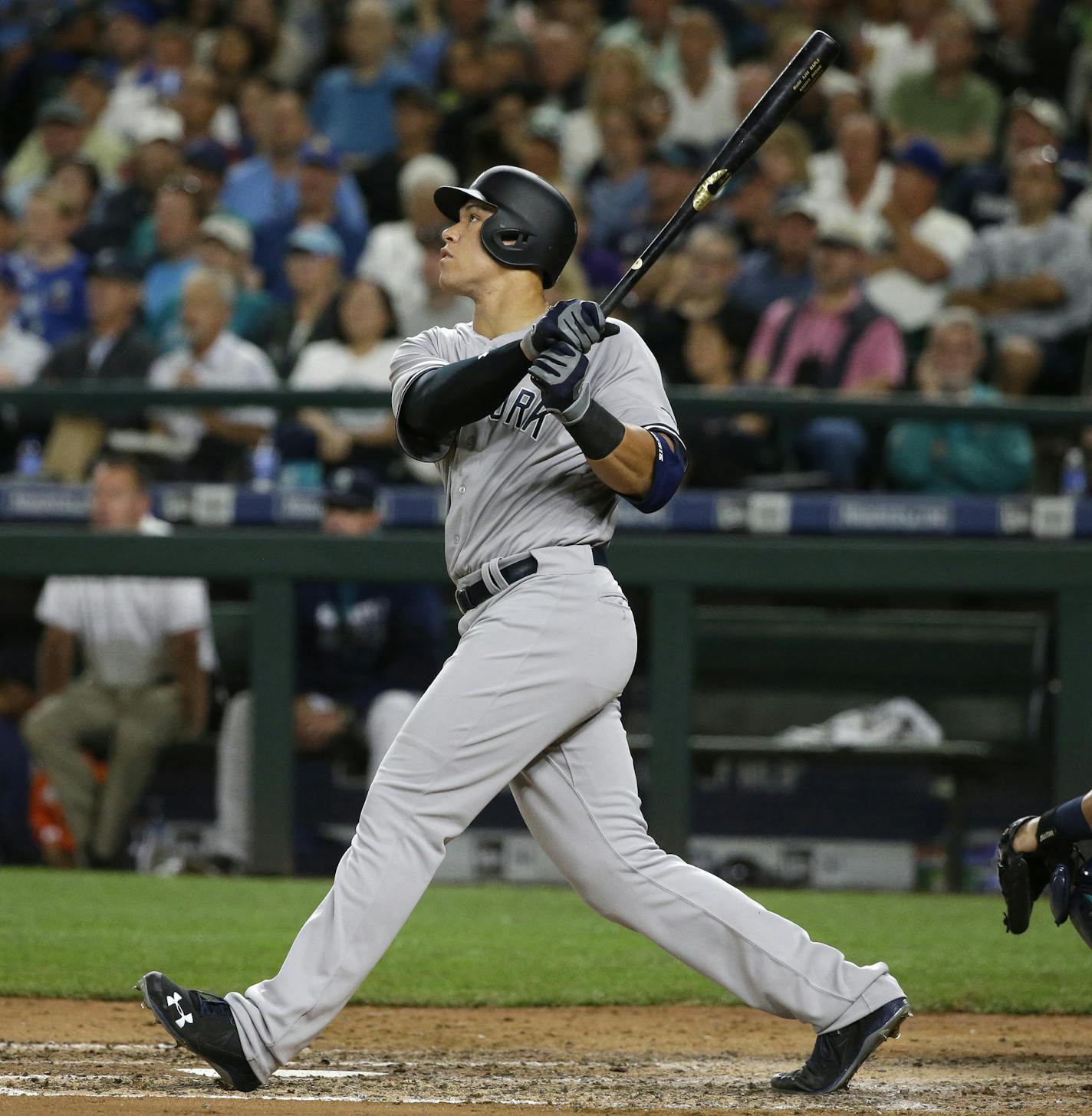 New York Yankees' Aaron Judge watches his sacrifice fly that scored Mark Teixeira during the sixth inning of a baseball game against the Seattle Mariners, Tuesday, Aug. 23, 2016, in Seattle. (AP Photo/Ted S. Warren) ORG XMIT: WATW111