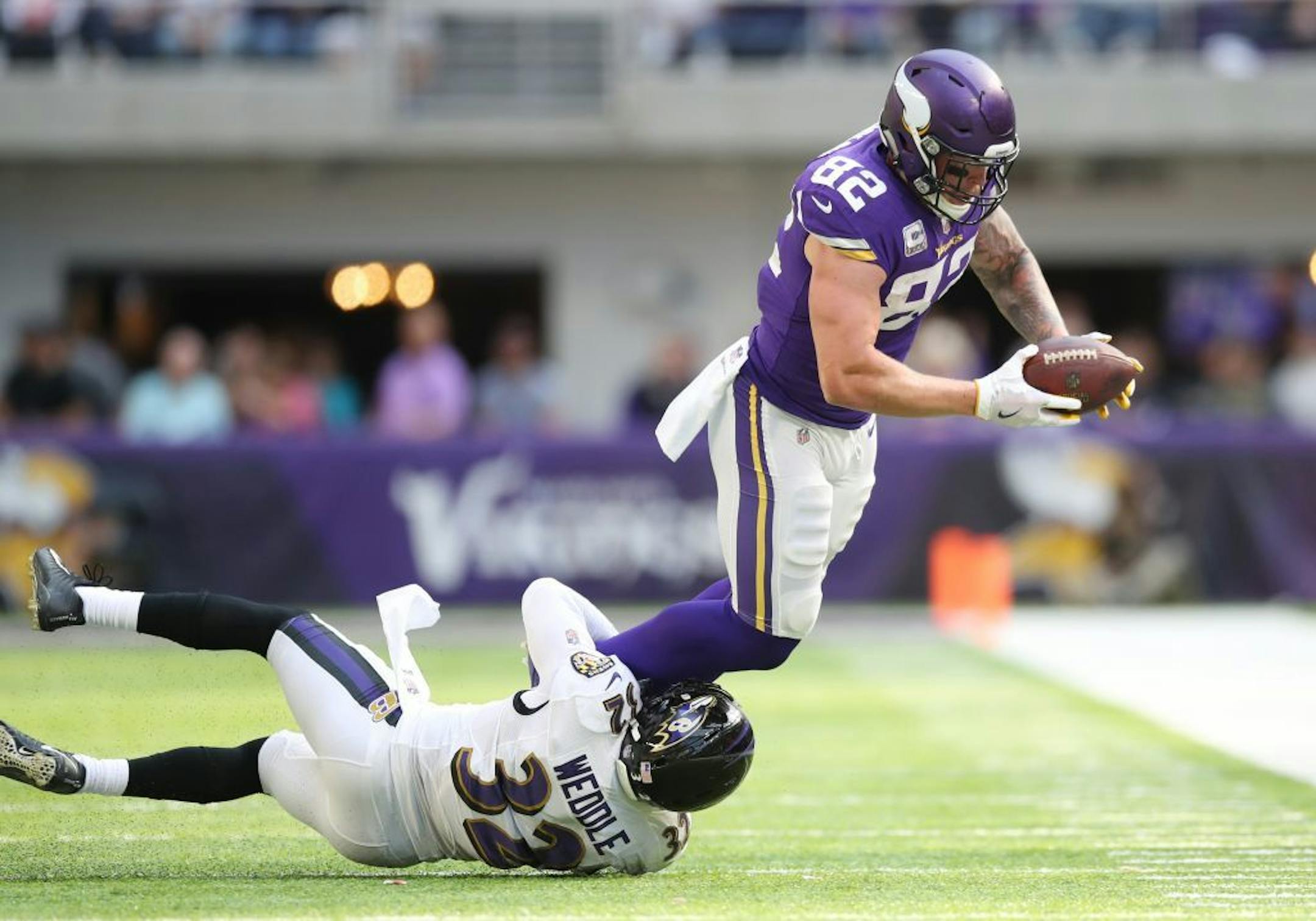 Minnesota Vikings tight end Kyle Rudolph (82) picked up a first down, as Baltimore Ravens free safety Eric Weddle (32) made the tackle in the second quarter at U.S Bank Stadium Sunday October 22,2017 Minneapolis , MN.