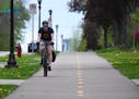 Sean Gulbranson commutes home to Roseville along a bike path on Como Avenue in St. Paul.