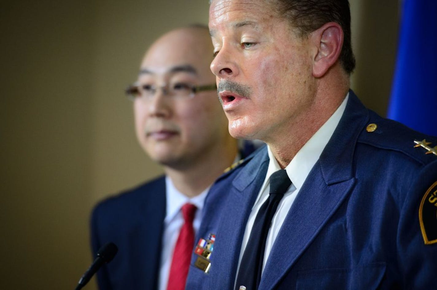 St. Paul Police Chief Tom Smith, foreground, and Ramsey County Attorney John Choi spoke during a news conference Wednesday announcing that there would be no charges against the archdiocese in the handling of abuse allegations against convicted priest Curtis Wehmeyer.