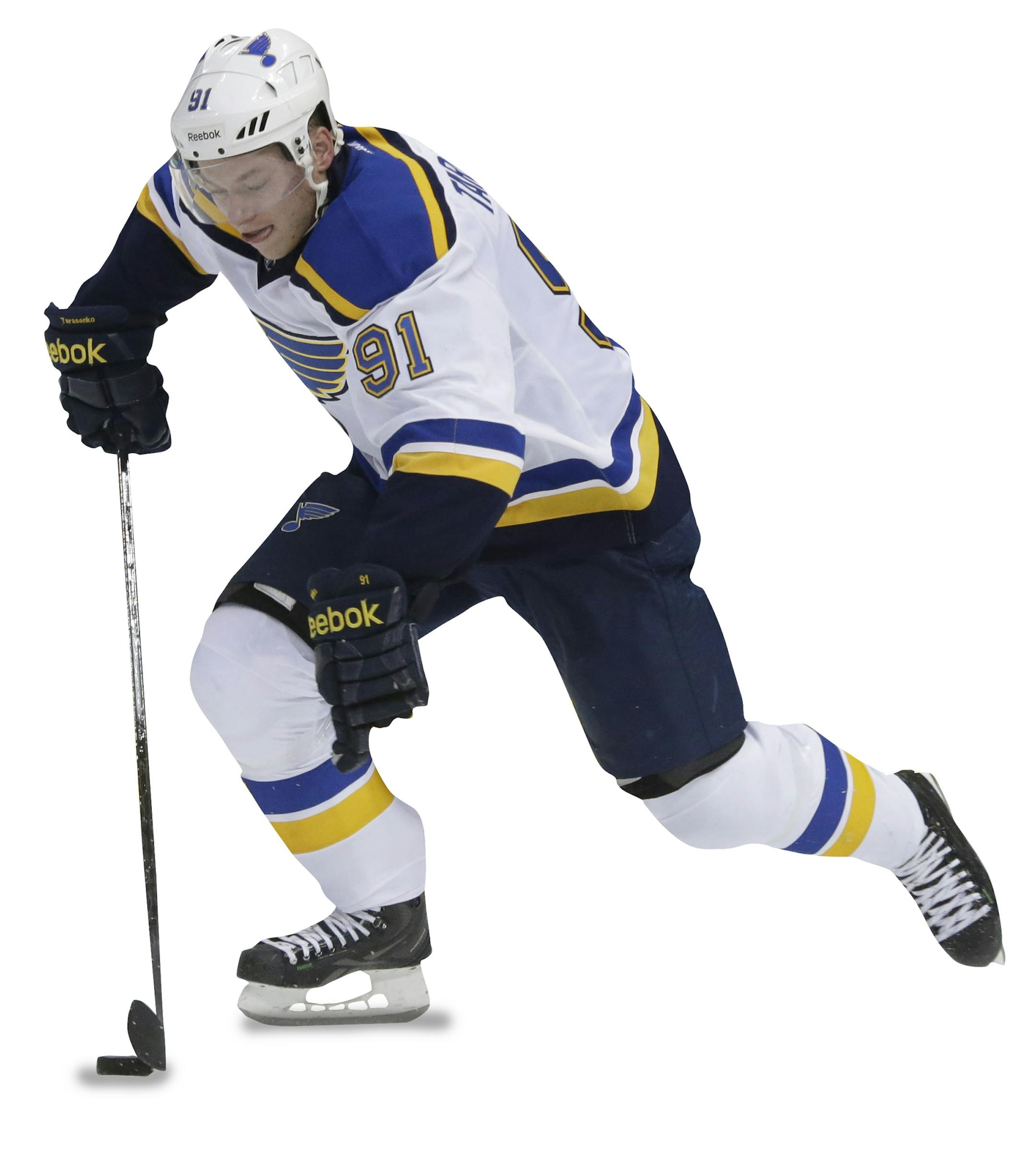 St. Louis Blues right wing Vladimir Tarasenko (91) skates with the puck past Dallas Stars defenseman Jordie Benn (24) during the first period of an NHL hockey game, Tuesday, Oct. 28, 2014, in Dallas. (AP Photo/LM Otero) ORG XMIT: DNA101